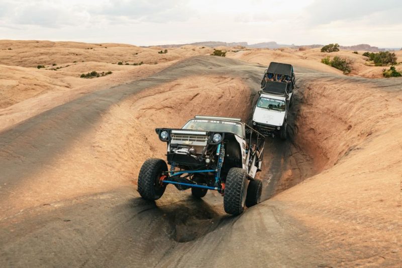 Off-road vehicles navigate a rugged terrain in Utah, showcasing exciting outdoor adventure activities for nature lovers.